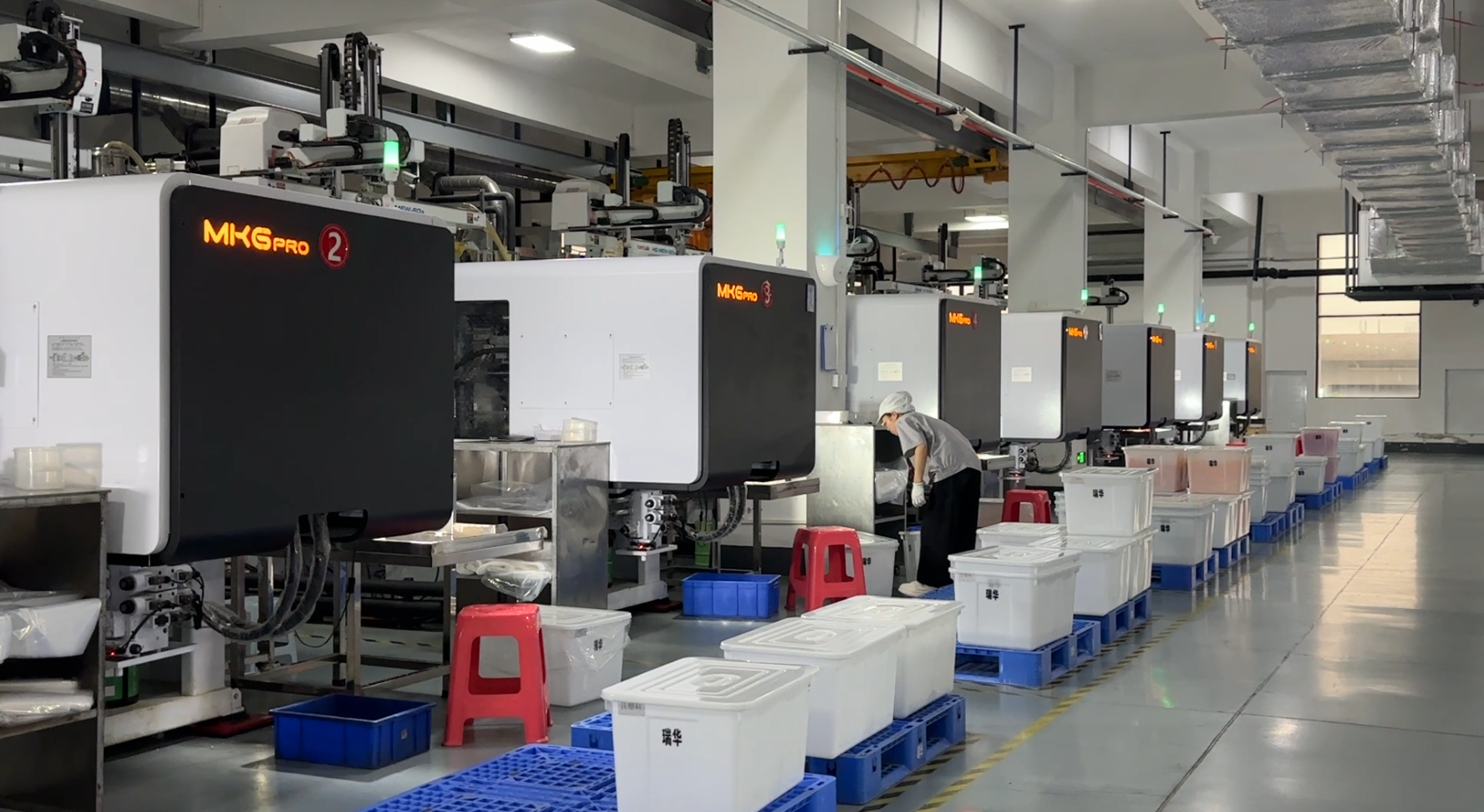 Dust-free injection molding workshop producing custom spout caps for stand-up pouches