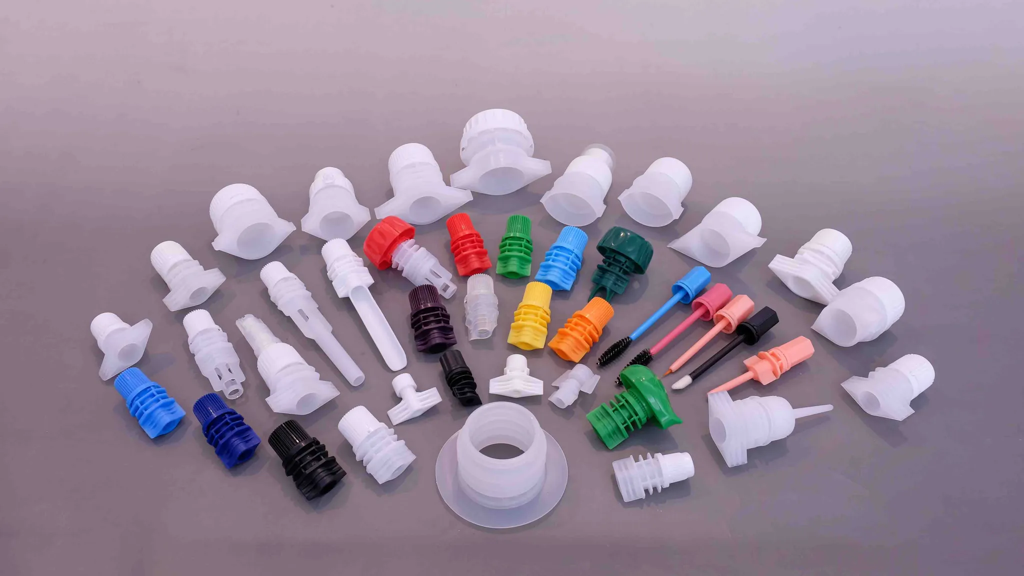 Food-grade plastic spout caps and fitments for stand-up pouches, showing the flange ring and thread the pouch seal closes around