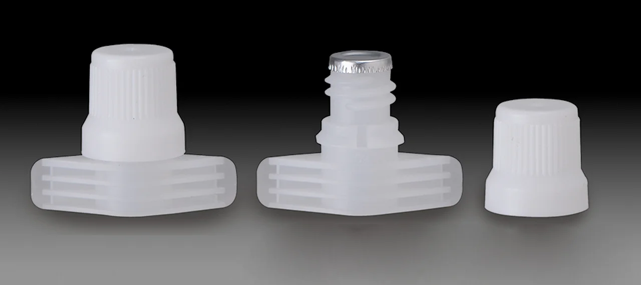 A spout cap family with the middle part showing an aluminium induction seal welded across the spout mouth
