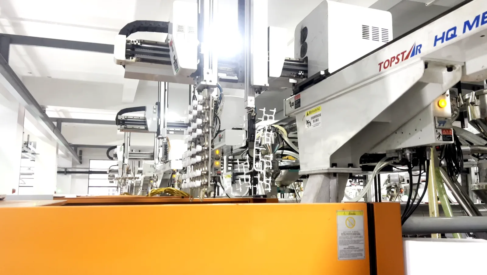 Injection workshop interior during spout cap sampling and mold trials