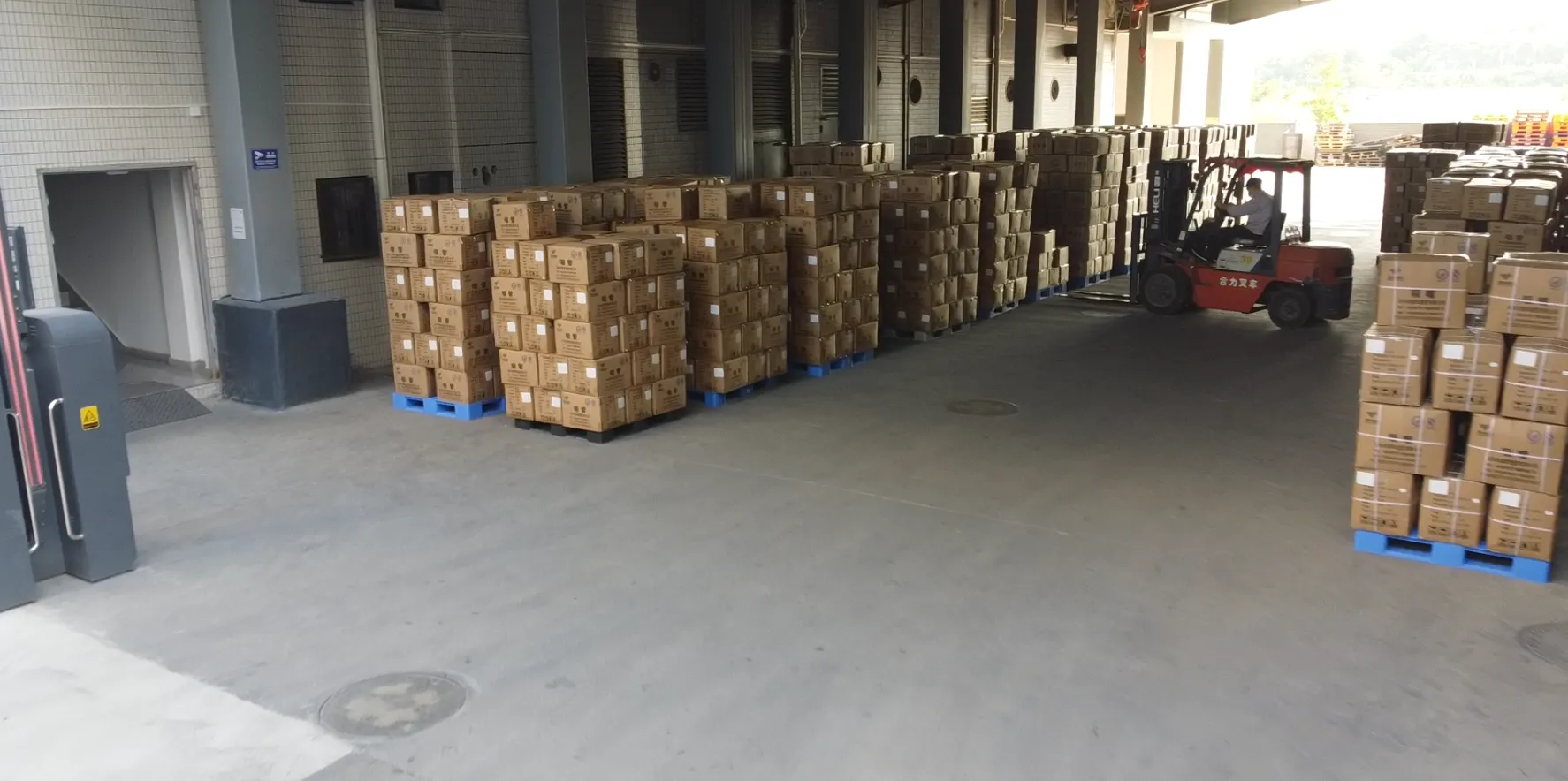 Finished-goods warehouse storing stock spout cap models ready for quick shipment